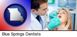 Blue Springs, Missouri - a dentist examining teeth