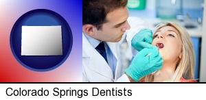 Colorado Springs, Colorado - a dentist examining teeth