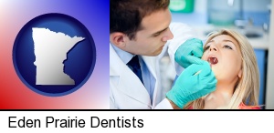 a dentist examining teeth in Eden Prairie, MN