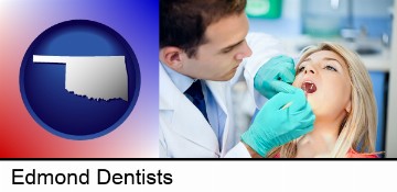 a dentist examining teeth in Edmond, OK