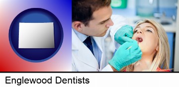 a dentist examining teeth in Englewood, CO