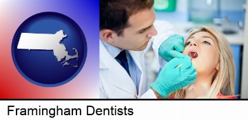 a dentist examining teeth in Framingham, MA