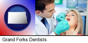Grand Forks, North Dakota - a dentist examining teeth