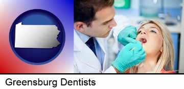 a dentist examining teeth in Greensburg, PA