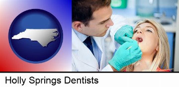 a dentist examining teeth in Holly Springs, NC