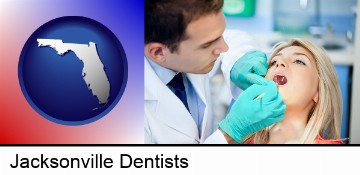a dentist examining teeth in Jacksonville, FL