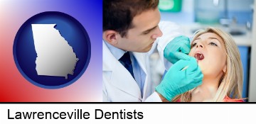 a dentist examining teeth in Lawrenceville, GA