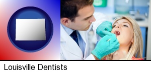 Louisville, Colorado - a dentist examining teeth