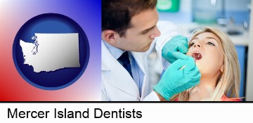 a dentist examining teeth in Mercer Island, WA