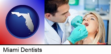 a dentist examining teeth in Miami, FL