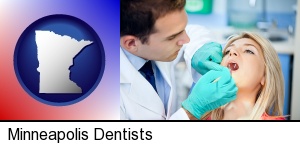 Minneapolis, Minnesota - a dentist examining teeth