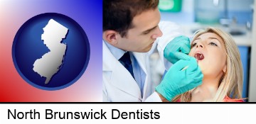 a dentist examining teeth in North Brunswick, NJ