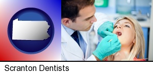 a dentist examining teeth in Scranton, PA