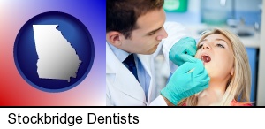 a dentist examining teeth in Stockbridge, GA