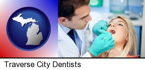 Traverse City, Michigan - a dentist examining teeth