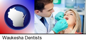 Waukesha, Wisconsin - a dentist examining teeth