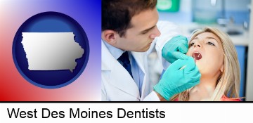 a dentist examining teeth in West Des Moines, IA