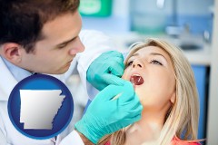 a dentist examining teeth - with AR icon