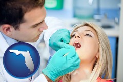 florida map icon and a dentist examining teeth