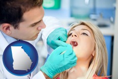 a dentist examining teeth - with Georgia icon