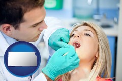 kansas map icon and a dentist examining teeth