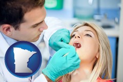 minnesota map icon and a dentist examining teeth