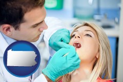 pennsylvania map icon and a dentist examining teeth