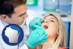 a dentist examining teeth - with WI icon
