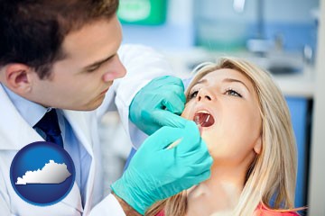 a dentist examining teeth - with Kentucky icon