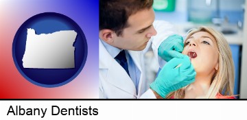 a dentist examining teeth in Albany, OR