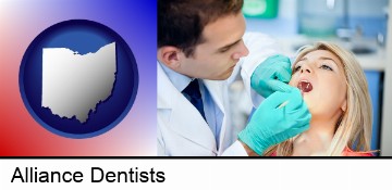a dentist examining teeth in Alliance, OH