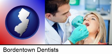 a dentist examining teeth in Bordentown, NJ