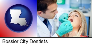 Bossier City, Louisiana - a dentist examining teeth