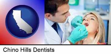 a dentist examining teeth in Chino Hills, CA