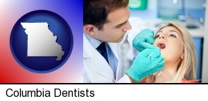 Columbia, Missouri - a dentist examining teeth