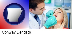 Conway, Arkansas - a dentist examining teeth