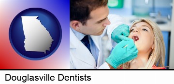 a dentist examining teeth in Douglasville, GA