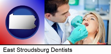 a dentist examining teeth in East Stroudsburg, PA