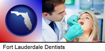 a dentist examining teeth in Fort Lauderdale, FL