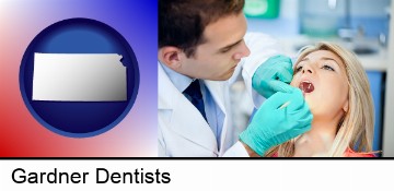 a dentist examining teeth in Gardner, KS