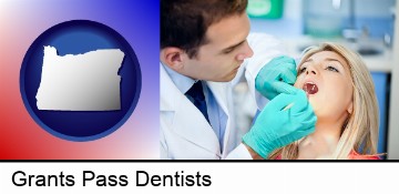 a dentist examining teeth in Grants Pass, OR