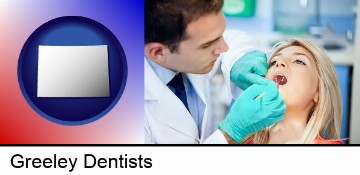 a dentist examining teeth in Greeley, CO