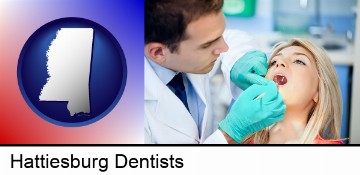 a dentist examining teeth in Hattiesburg, MS