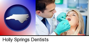 Holly Springs, North Carolina - a dentist examining teeth