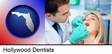 a dentist examining teeth in Hollywood, FL