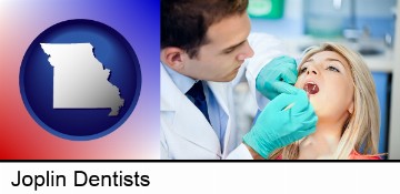 a dentist examining teeth in Joplin, MO