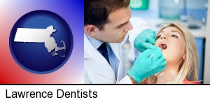 a dentist examining teeth in Lawrence, MA