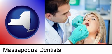 a dentist examining teeth in Massapequa, NY