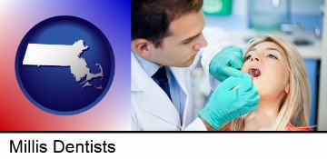 a dentist examining teeth in Millis, MA