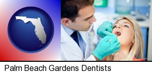 Palm Beach Gardens, Florida - a dentist examining teeth